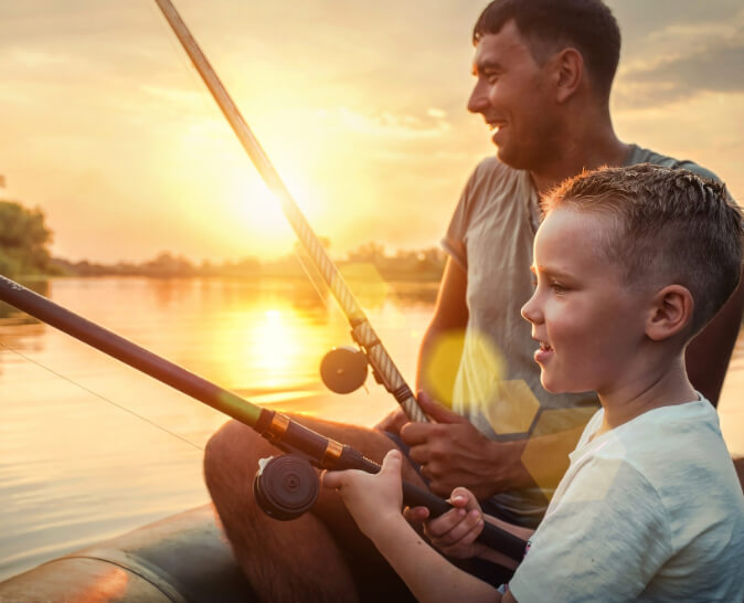 Image of father and son fishing.